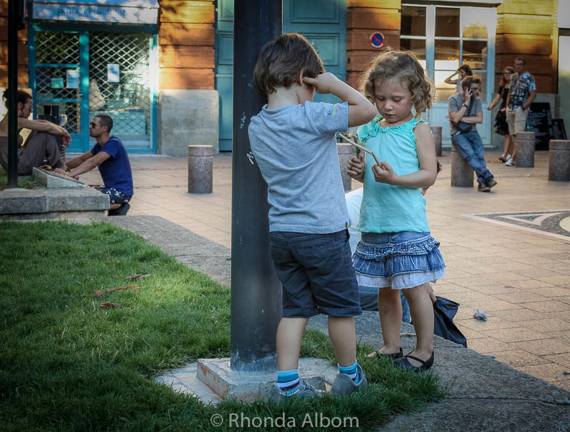 Two adorable kids in a square in Toulouse France
