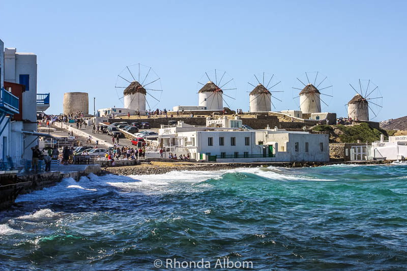 Windmills of Mykonos seen as we walked the coastline Greece.