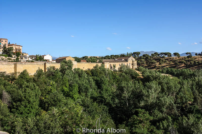 View of the city wall surrounding Segovia Spain