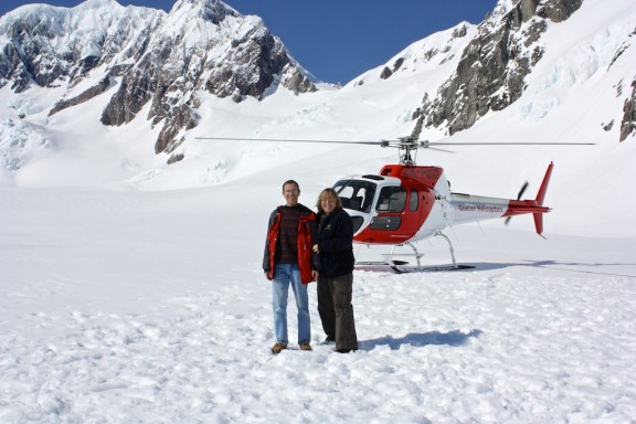 Standing on Fox Glacier in front of the hellcopter that brought us here.