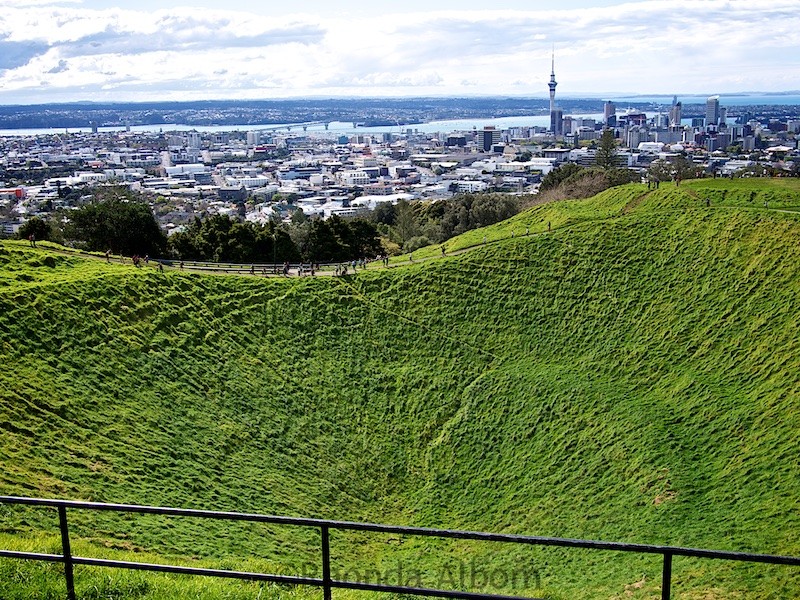 View of the Mt Eden crater and city at the top of Mt. Eden. It is one many extinct volcanoes in New Zealand