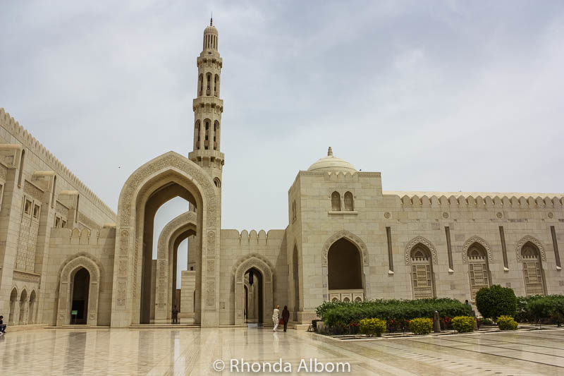 Courtyard and minaret at the Grand Mosque of Muscat Oman, one of the best places to visit in Muscat