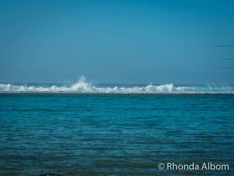 Waves breaking on reef seen from Moana Sands Lagoon Resort on Rarotonga, Cook Islands