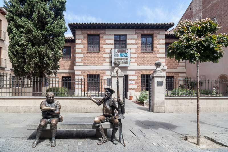 Museum and house birthplace of Miguel de Cervantes with statues of Quijote and Sancho in Alcala de Henares, Spain