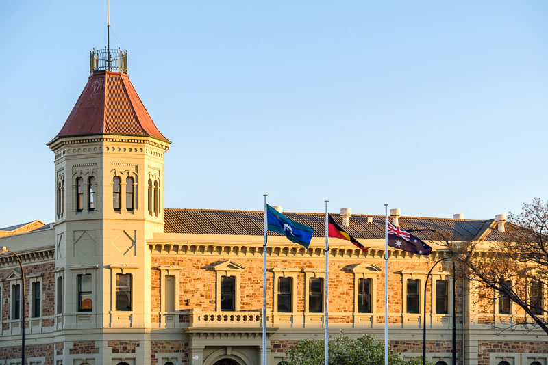 Port Adelaide Institute histroric building viewed from the docks at sunset