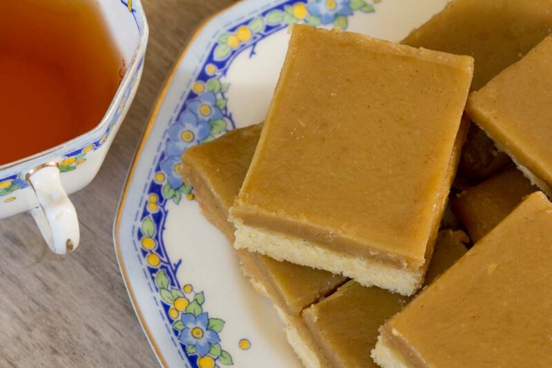 Ginger Slice on a Plate with a cup of tea, a popular NZ dessert or afternoon tea